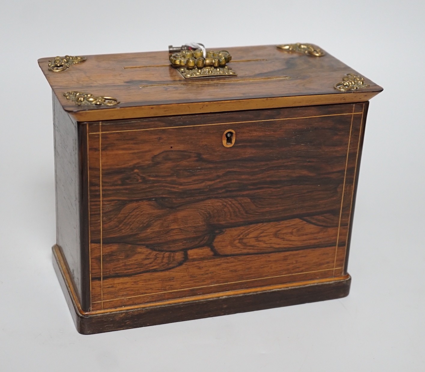 A late 19th century French rosewood letter box, with brass mounts, handle and key, 15.5cms high x 19.5cms wide